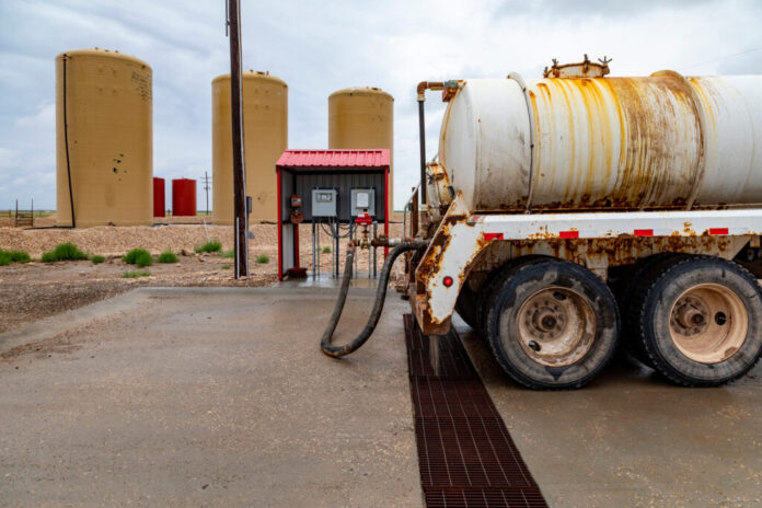 Tanks hold oilfield waste for disposal in the Permian Basin. Credit: Jim West/UCG/Universal Images Group via Getty Images
